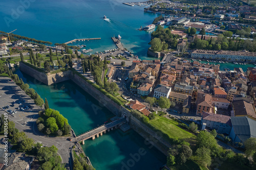 Top view of the town of Peschiera del Garda, the main gate of Porta Brescia located on the shores of Lake Garda. The largest lake in Italy. Resorts on Lake Garda Italy. City on the water Italy.