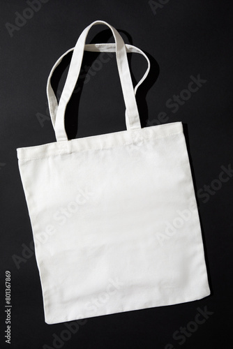White tote bag against black background photo