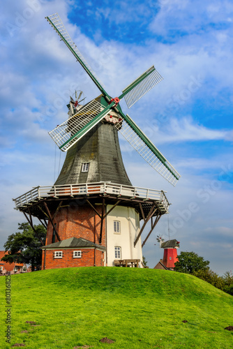 Twin windmills in Greetsiel, East Frisia, Germany. © DirkR