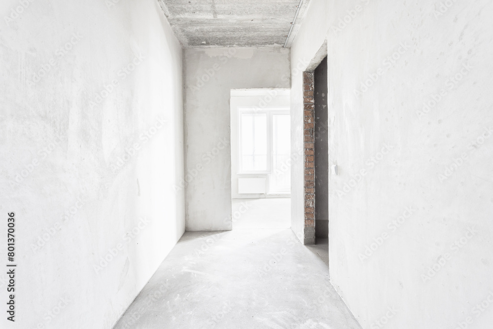 interior of the apartment without decoration in gray colors. rough finish