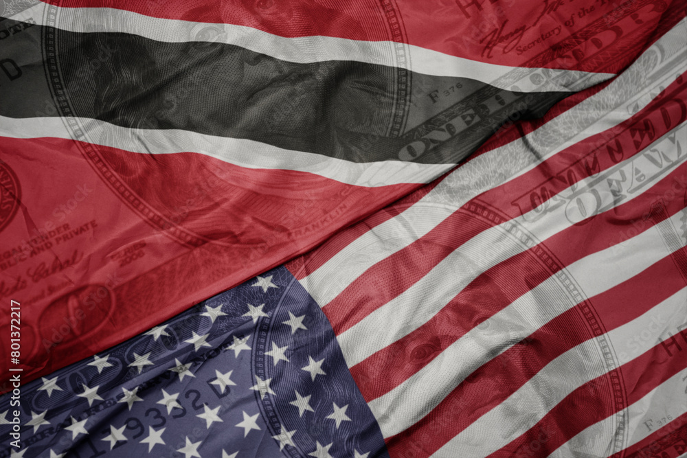 Obraz premium waving colorful flag of united states of america and national flag of trinidad and tobago on the dollar money background. finance concept.