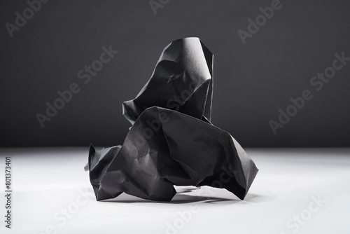 Studio shot of black crumpled paper photo