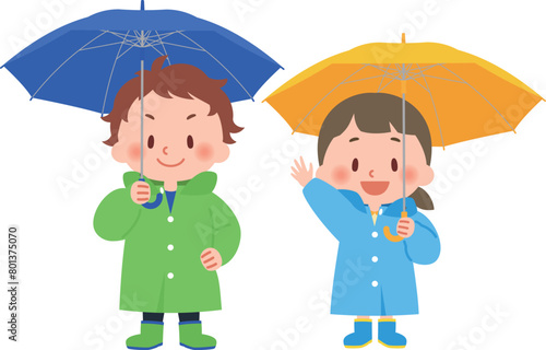 傘をさす雨具を身につけた子供たち
