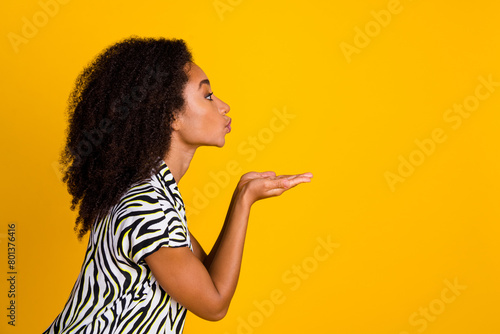 Portrait photo of glamour young charming woman curly hair in zebra print shirt hold hands plump lips isolated on yellow color background