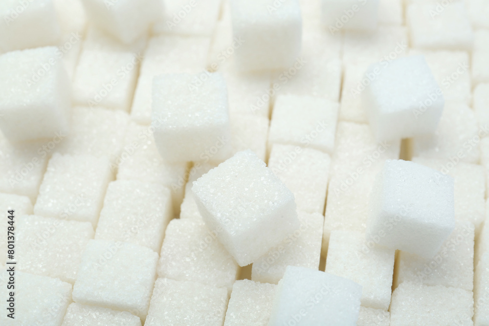 White sugar cubes as background, closeup view White sugar cubes as background, closeup view
