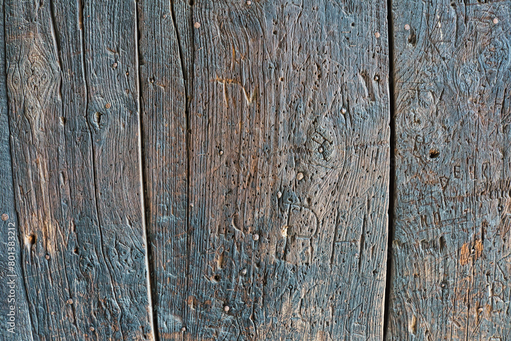 Vintage Charm: Very Old Wooden Wall with Distinctive Texture and Signs of Age