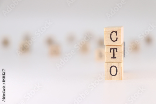 CTO acronym. Concept of chief technology officer written on wooden cubes isolated on white background. photo