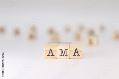AMA word. Concept of ask me anything written on wooden cubes isolated on white background. photo