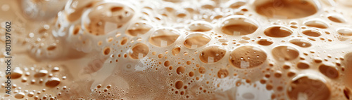 Frothy Milk Foam Art: Close-Up of Textured and Frothy Milk Foam Art in Coffee Beverage