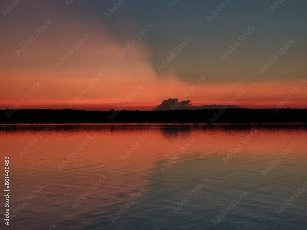 Naklejka premium sunset over the river