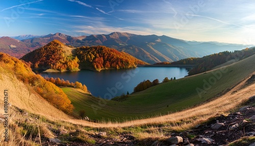 scenic panoramic view of mountains autumn landscape lake and colorful hills at sunset