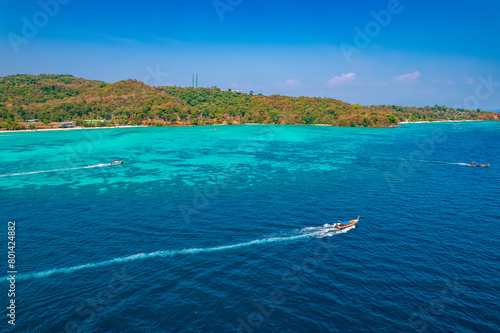 Amazing travel landscape photo in Thailand tourism. Aerial top view longtail boat on Phi Phi, turquoise clear water in Krabi