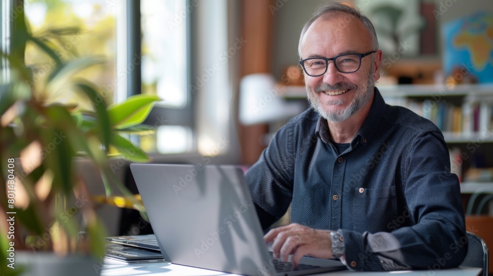 Smiling Senior Man at Computer Smiling Senior Man at Computer