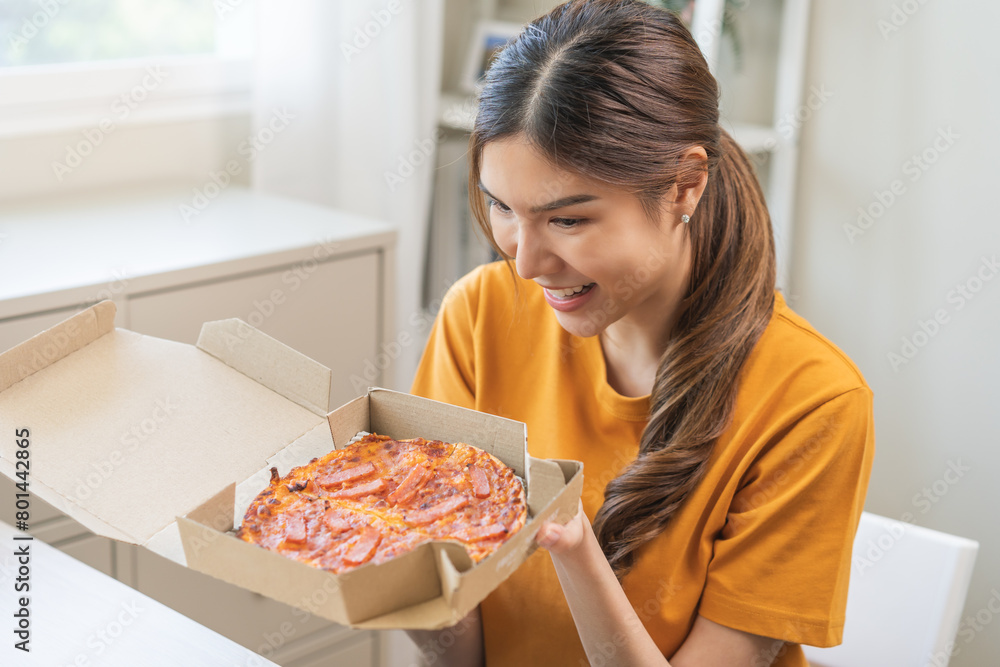 Happy meal with fast food, pleasure asian young woman, girl hold food box, enjoy eating delicious with pizza having takeaway at home relaxing resting, like taste good appetite, snack in lunch, dinner