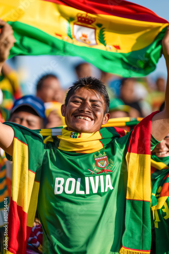 Bolivian football soccer fans in a stadium supporting the national team, with scarfs and flags, La Verde  © PixelGallery