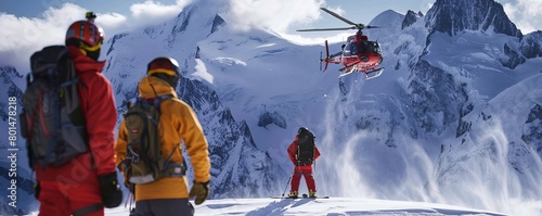 Snowboarders watching a heli take off after being dropped off on a remote peak in the backcountry photo