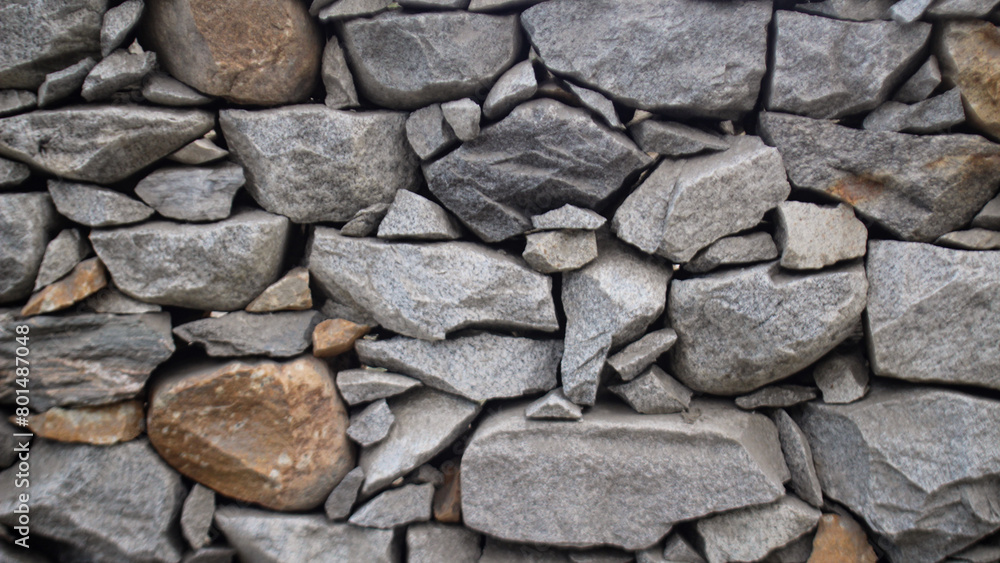 Close-up of an ancient stone and brick wall with a historical tors wall texture in the background. Rugged rocky crags and peaks complete the scene. Close-up of an ancient stone and brick wall with a historical tors wall texture in the background. Rugged rocky crags and peaks complete the scene.