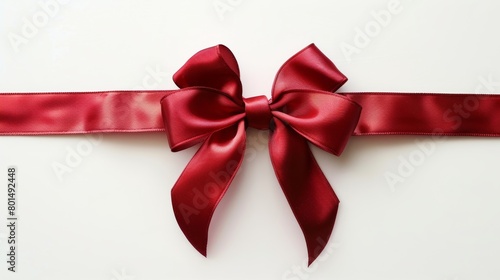 Red gift ribbon bow straight horizontal isolated on white