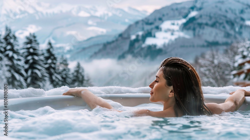 Woman Relaxing in Hot Tub with Mountain View  © Creative Valley