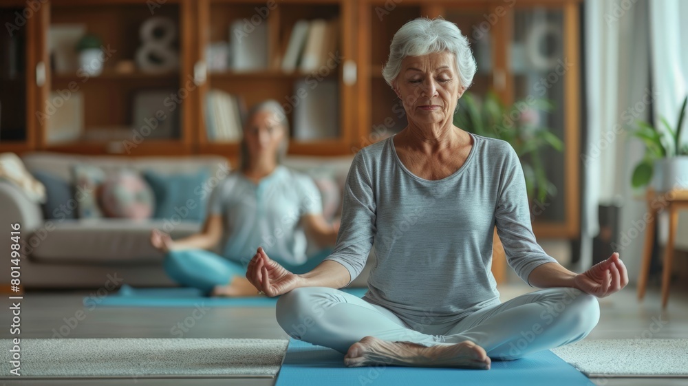 elder woman and young woman meditating together in the living room elder woman and young woman meditating together in the living room