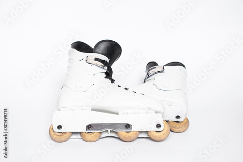 Aggressive roller skates for extreme skating, old, lie on a white background, sport