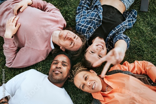 Happy diverse friends in a park  friendship photo