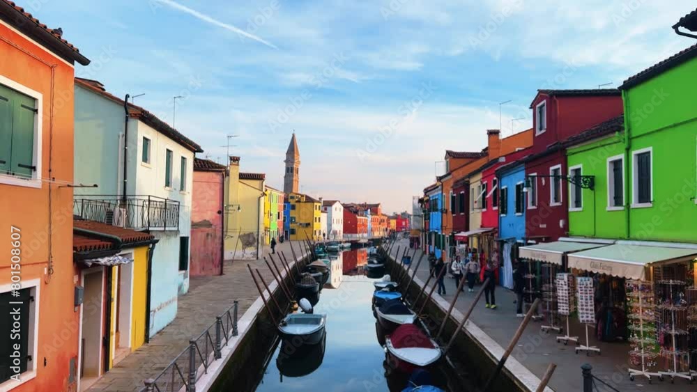 Burano View: Colorful houses, canals and waterways in Italy's timeless city where gondolas glide beneath arched bridges in a historic city that floats on romance Burano View: Colorful houses, canals and waterways in Italy's timeless city where gondolas glide beneath arched bridges in a historic city that floats on romance
