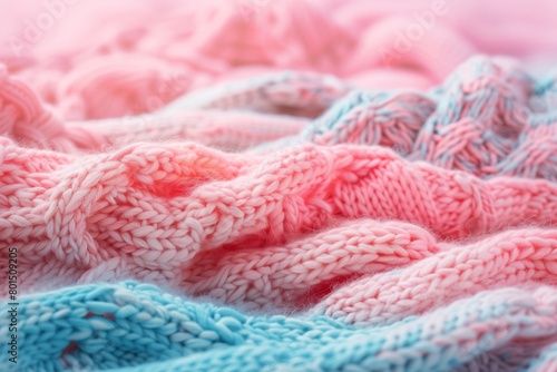 A knitted sweater with a pink, blue, and purple color pattern