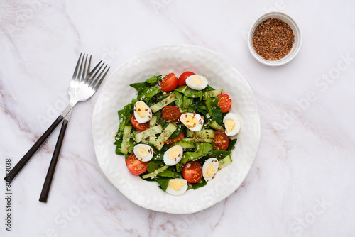Wallpaper Mural Fresh healthy vegetable salat: cucumber, tomatoes, spinach, couscous, quail eggs, flax seeds on marble background. Top view. Torontodigital.ca