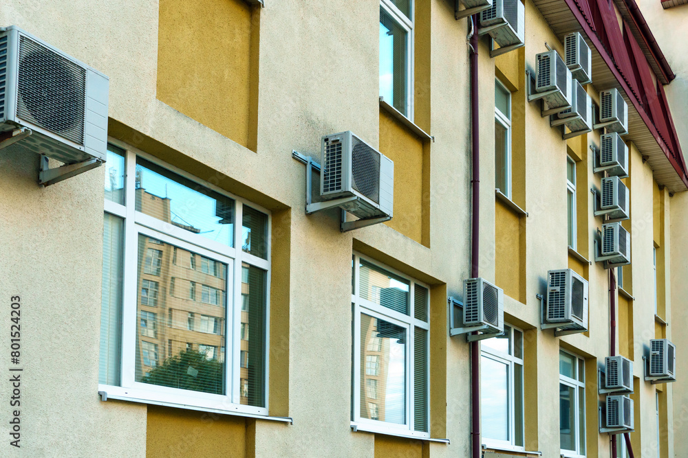 Outdoor air conditioning unit. A large modern air conditioner on the wall of an apartment building. Repair and maintenance of the air conditioning system Outdoor air conditioning unit. A large modern air conditioner on the wall of an apartment building. Repair and maintenance of the air conditioning system
