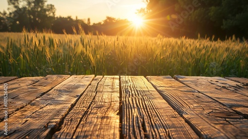 rustic wooden table with prosperous farm landscape at sunset agriculture concept photo