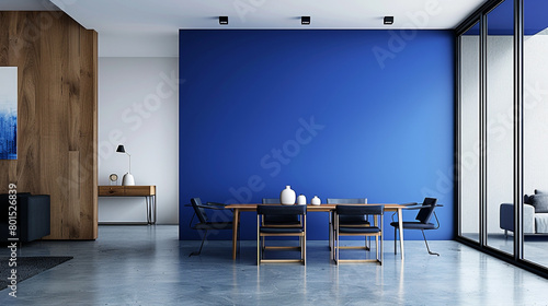 A minimalist dining area with a striking, cobalt blue feature wall and sleek, modern furniture, creating a colorful yet elegant space.