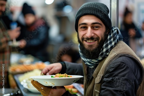 Happy muslim volunteer serving the homeless in the social center  close up. volunteer serving the homeless in the social center. The atmosphere seems to be friendly and welcoming.