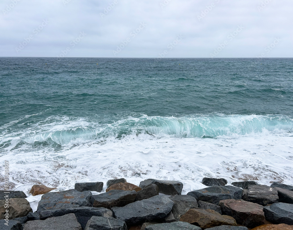 Beautiful view of the sea and stones on a day.  Lloret de Mar. Spain.