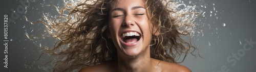 Joyful woman with wet curly hair