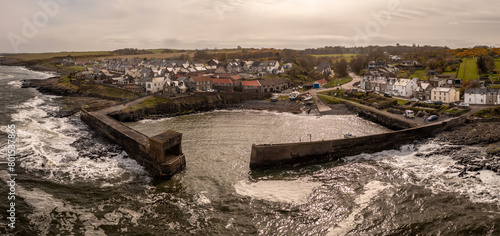 Aerial landscape view of Craster Harbour and village in Northumberland photo