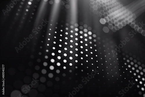 A dynamic array of white dots creates a sense of motion with light rays against a dark, blurred background (ID: 801540277)