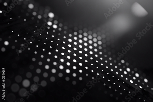 The background features a gradient of white dots forming a curved line pattern on a black backdrop, with a bright light source on the edge (ID: 801540289)