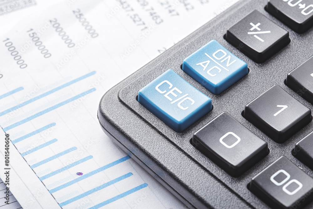 calculator and financial charts. Investment and capital accumulation concept calculator and financial charts. Investment and capital accumulation concept