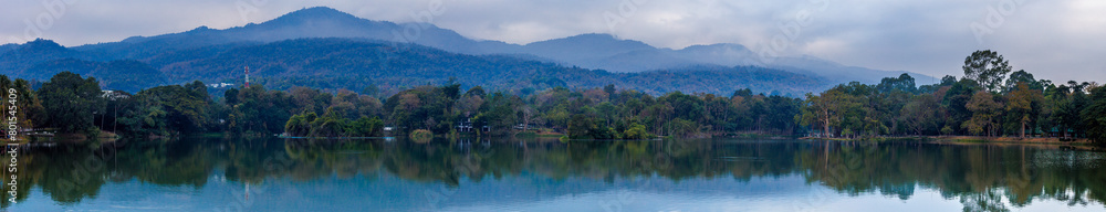 Ang Kaew lake with Doi Suthep mountains background in cloudy sky, Chiang mai , Thailand