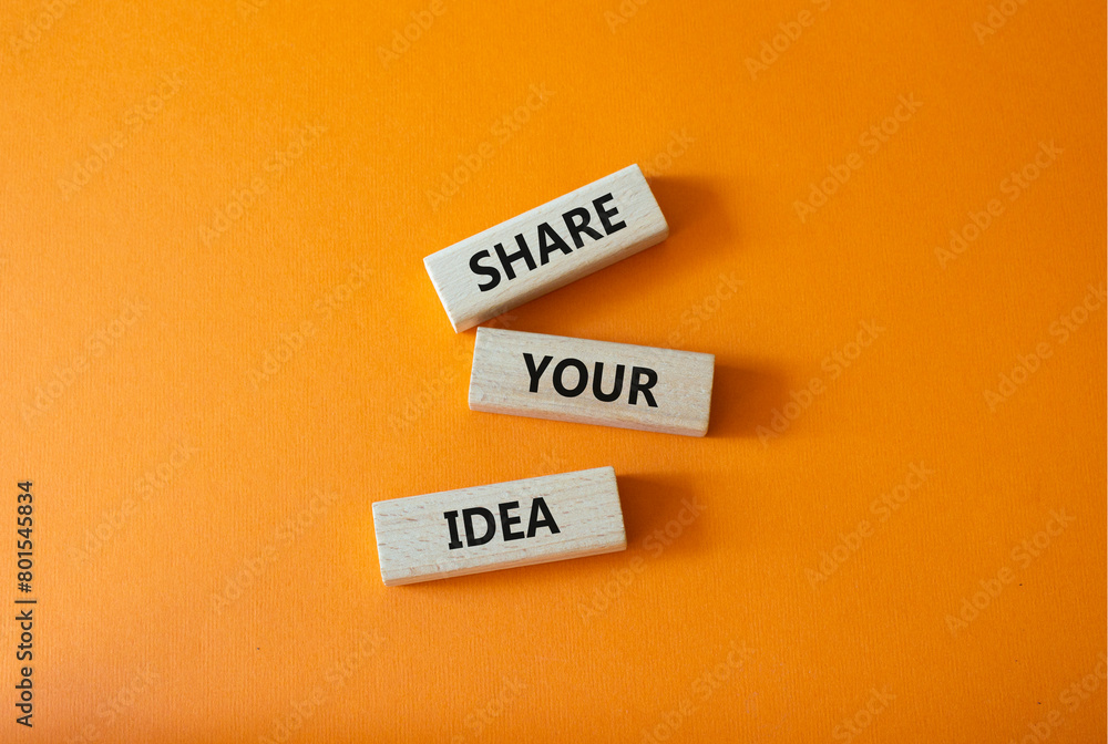 Share your Idea symbol. Concept words Share your Idea on wooden blocks. Beautiful orange background. Business and Share your Idea concept. Copy space.