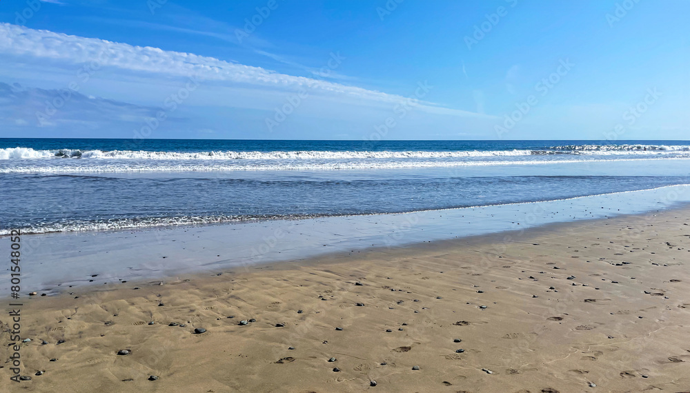 Waves roll onto the shore. Sea foam. Canary Islands sea view, Atlantic Ocean Waves roll onto the shore. Sea foam. Canary Islands sea view, Atlantic Ocean
