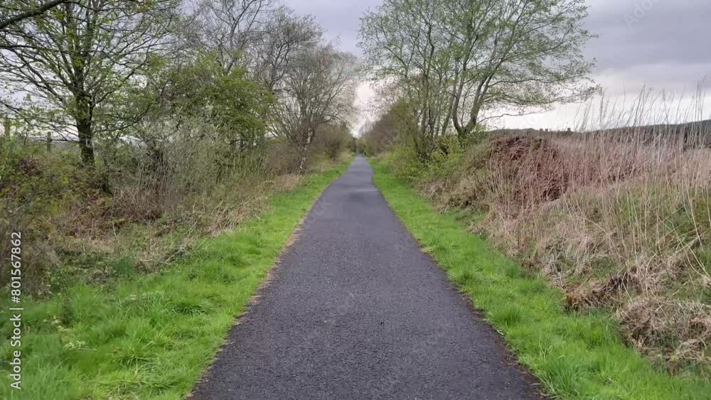 Cycle and walk path in countryside built on old railway line Cycle and walk path in countryside built on old railway line