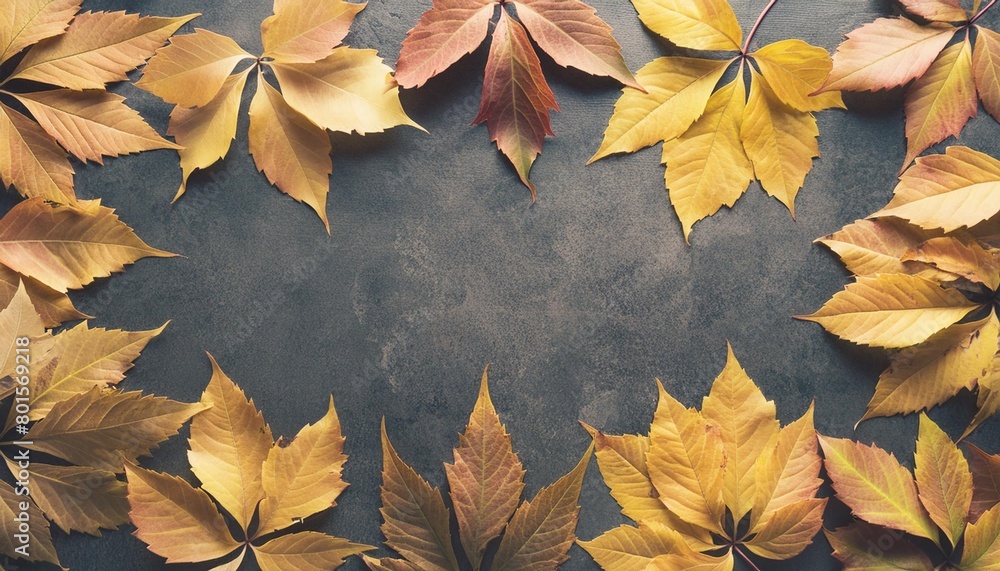 autumn season abstract background fall yellow leaves frame on stone surface thanksgiving day seasonal concept copy space