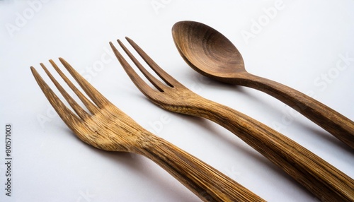 set of table ware with fork knife and spoon bamboo wood biodegradable recycled materials isolated on white photo