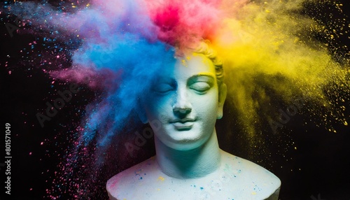 statue head with colorful rainbow holi paint powder explosion