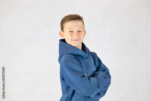 Portrait of a smiling boy in a hoodie, portrait of a boy