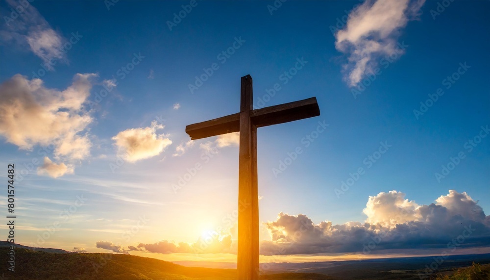 cross of jesus christ on the background of the sunset sky with clouds