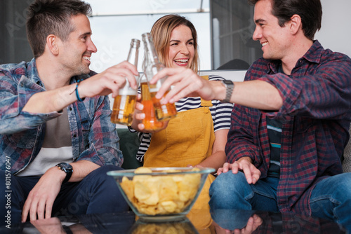 Three friends toasting at a gathering of friends at home. Concept: friendship, together bond