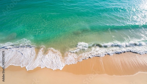 summer seascape beautiful waves blue sea water in sunny day top view from drone sea aerial view amazing tropical nature background beautiful bright sea with waves splashing and beach sand concept